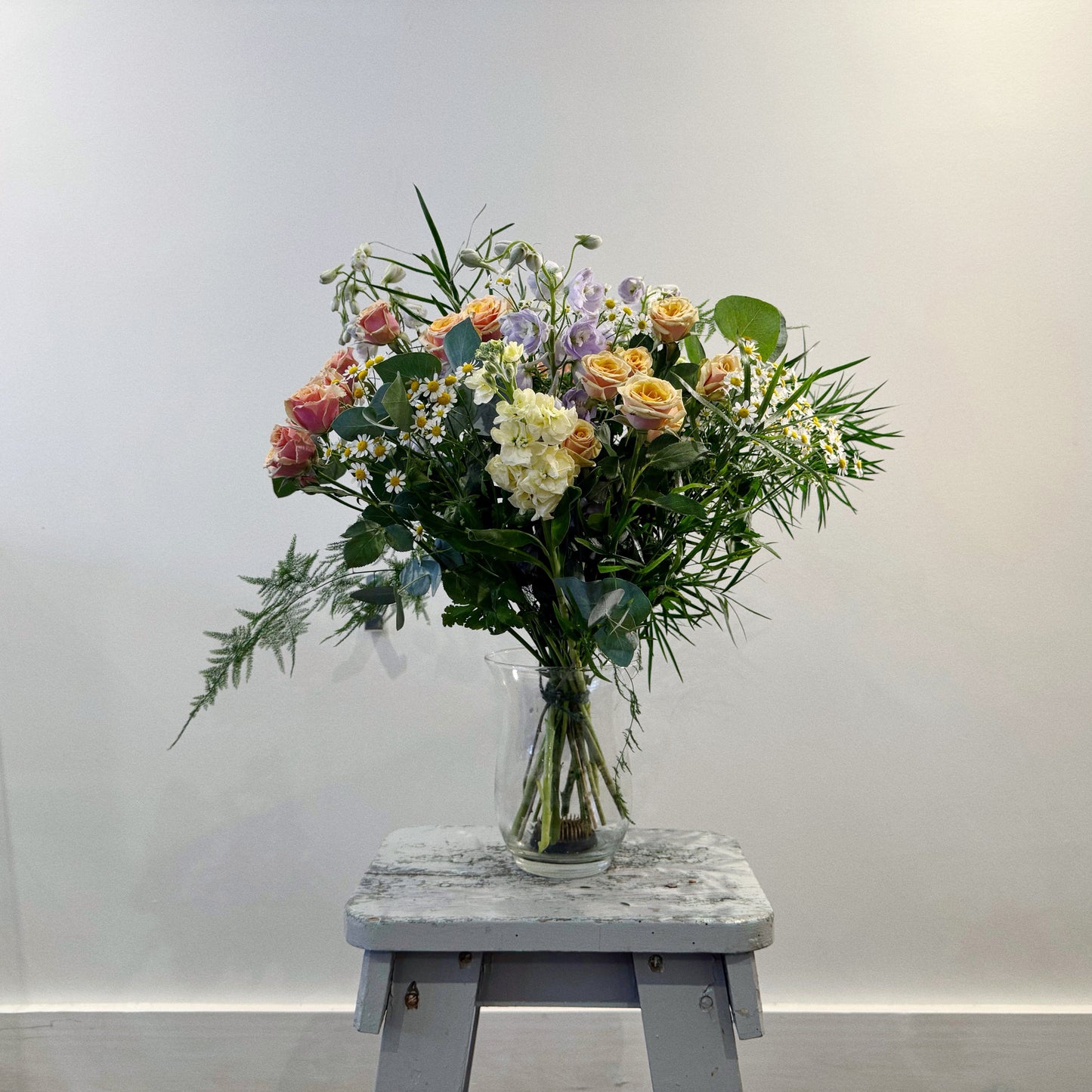 Pastel colours hand tied bouquet by Flowered Up