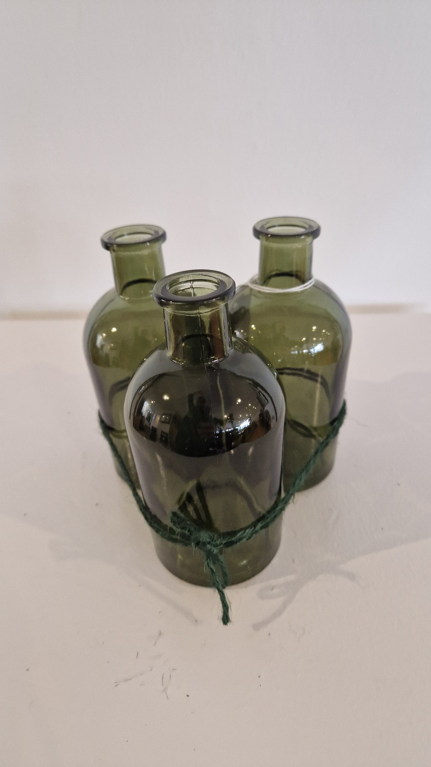 Trio of green vases.