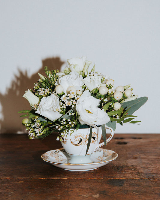 Flowers in a Vintage Cup and Saucer